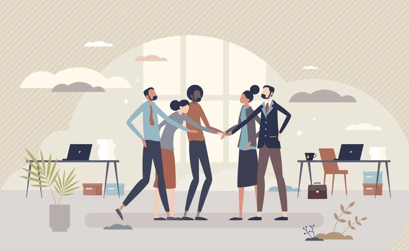 Team of professionals shaking hands in an office