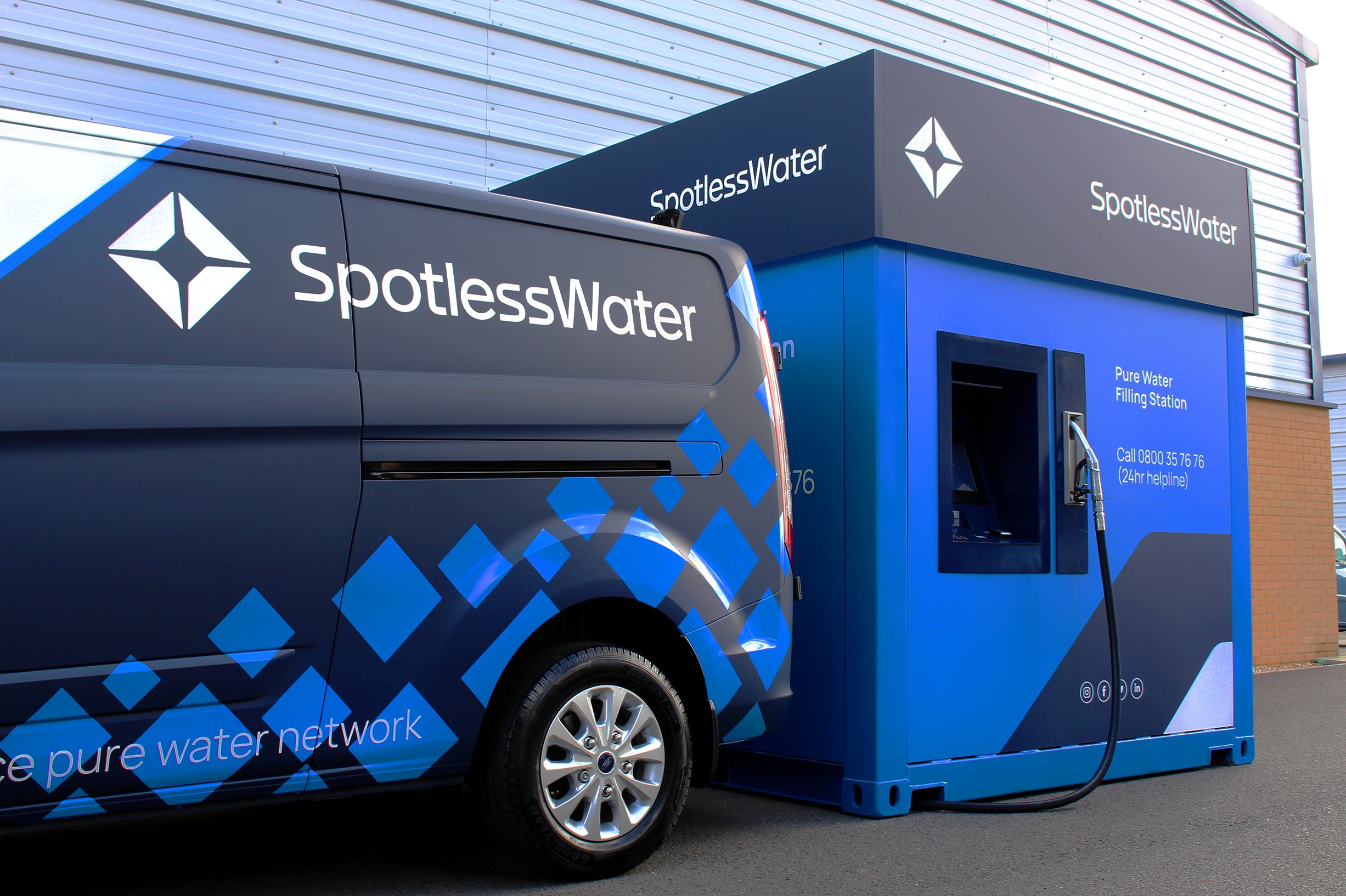 An image of a spotless water station and van.